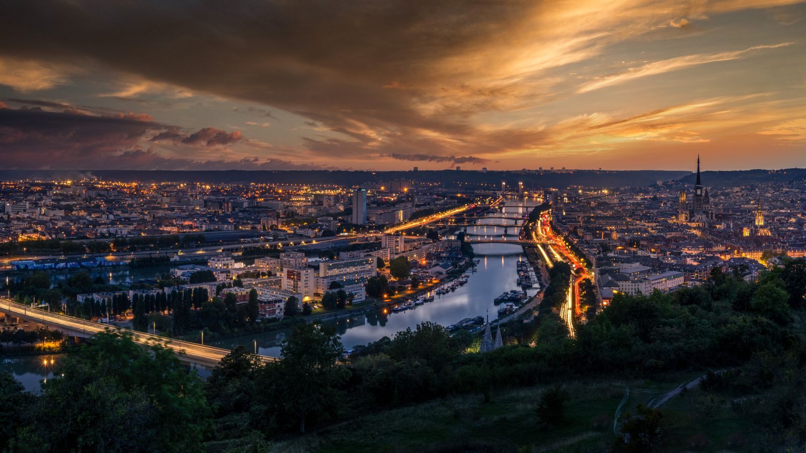 Seine river cruise country: Rouen and the Seine at sunset, seen from the hills above the city